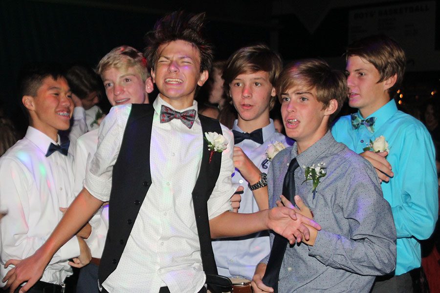 A group of freshmen dance to music in the main gym.