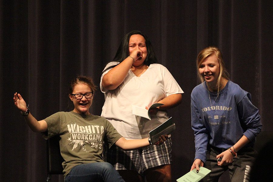 Rehearsing a script on Monday, Sept. 10, senior Claire Segura and juniors Cameron Vitt and Lauren ONeal, practice performing on stage.