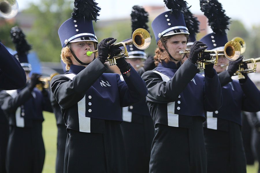 Before the Wednesday, Oct. 3 performance, junior Andrew Tow plays the trumpet in warm-up.