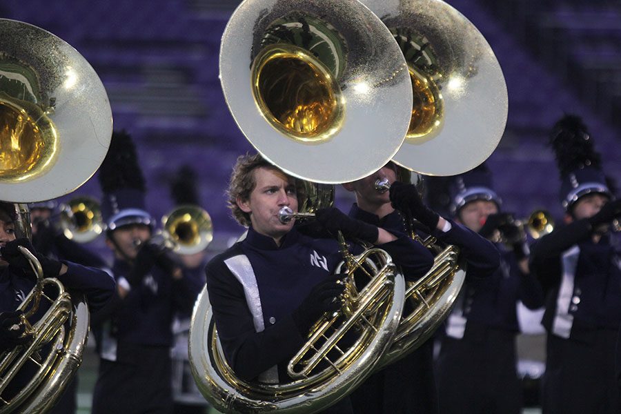 Starting off the show, senior Jakob Twigg plays in a line of tubas.