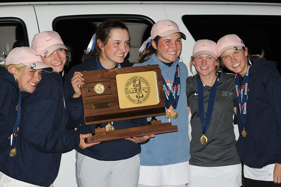 The girls golf team smiles with their first place trophy after the 6A state tournament in Salina, Kansas, making them the first 6A champions in Mill Valleys history. Senior Sarah Lawson placed second individually. I could not be happier for us, Lawson said. I am so proud of the girls I played with and I could not asked for a better group.