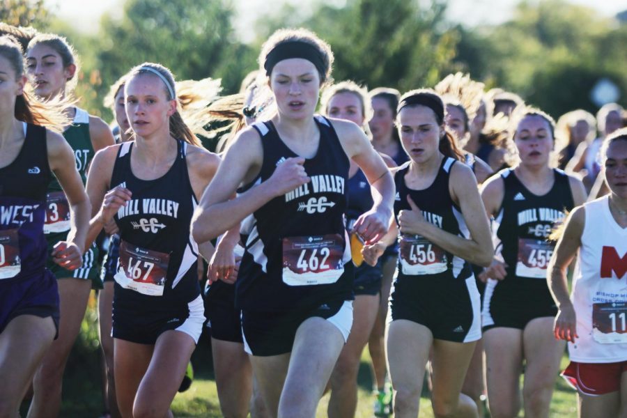 At the beginning of the race, sophomore Molly Ricker runs ahead of her competitors at the EKL tournament hosted by Blue Valley Southwest on Wednesday, Oct. 10. Girls placed first place and boys were runner-up.
