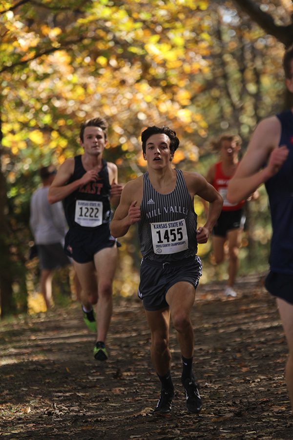 Reaching the 3rd mile mark, junior Jack Terry picks up the pace to get ahead of competing runners and finish the race with a placing of 15th and a time of 16:28.