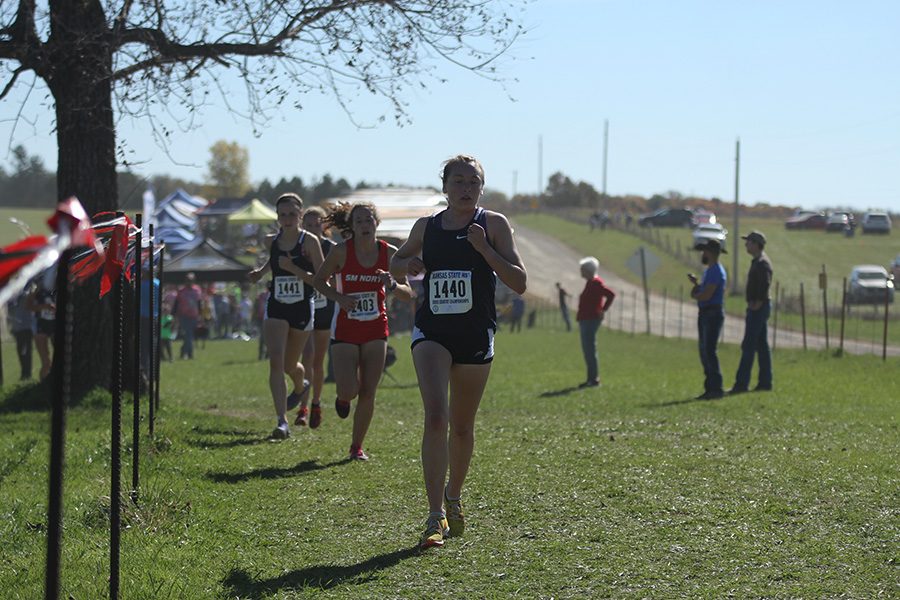 Starting off the race, senior Delaney Kemp looks determined in her performance, placing 4th overall with a time of 19:05.