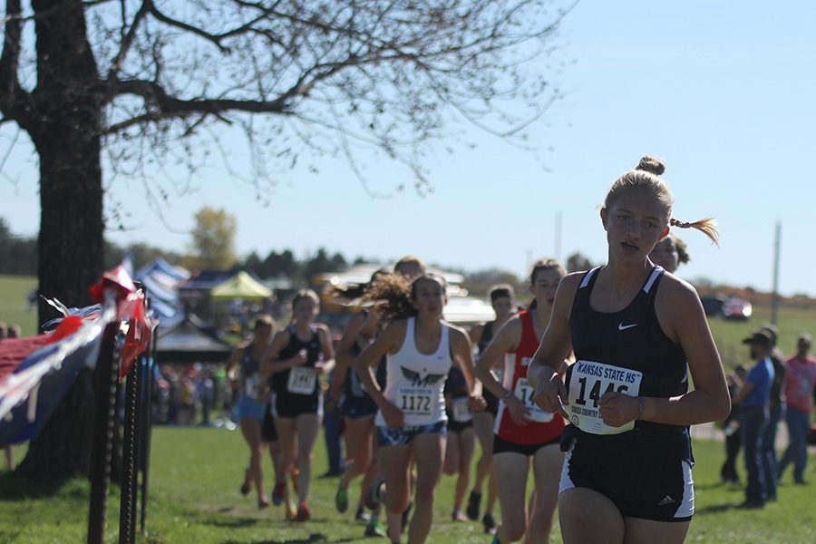 Starting the race off strong, sophomore Josie Taylor finds a steady pace to finish the race in 19th place.