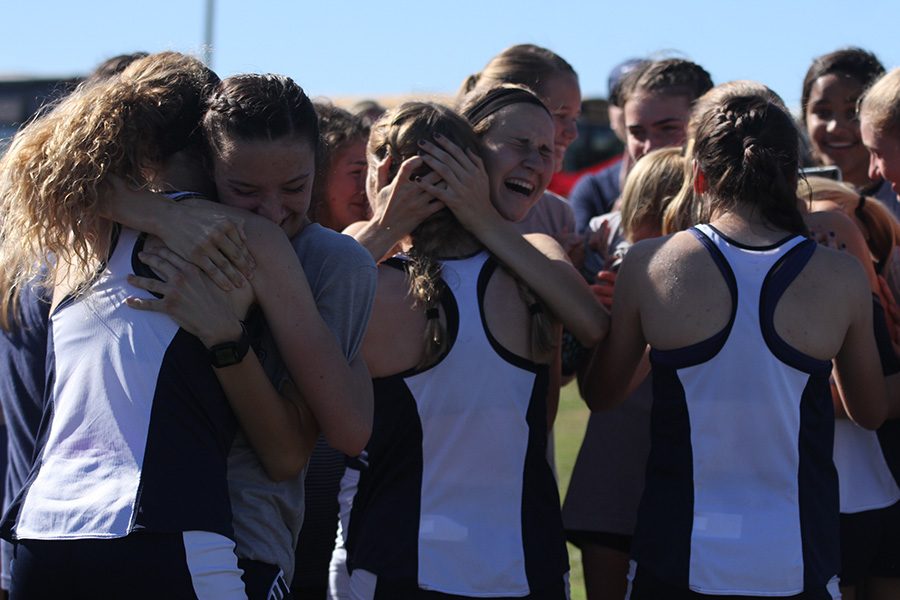 Congratulating each other, the girls team celebrate with each other after learning of their state placing.