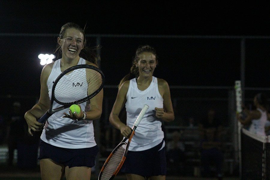 With big smiles, senior Anika Roy and junior Avery Altman jog off the court after winning their match on Friday Oct 5. 