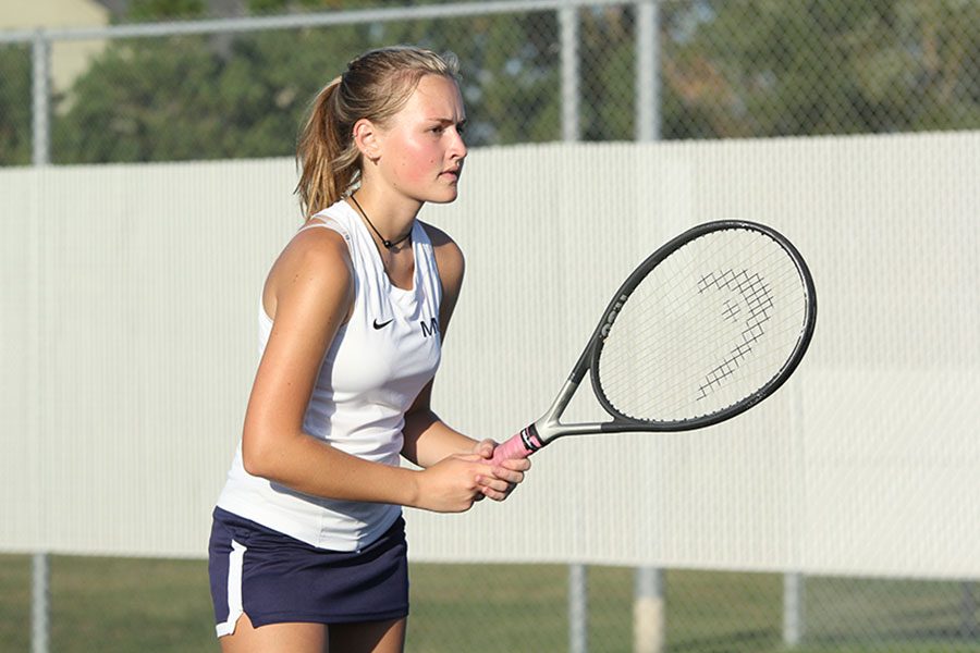 Senior Emme Hall prepares for her opponent to serve the ball.