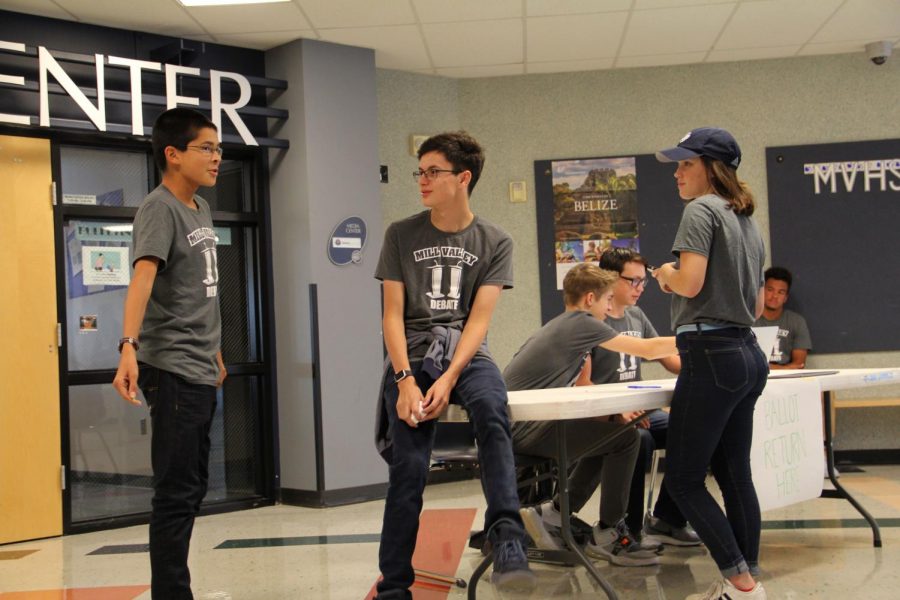 During the debate tournament on Saturday Sep. 29, sophomore Adam White gives orders to sophomore Jack Starcke and junior Sydney Vomhof.