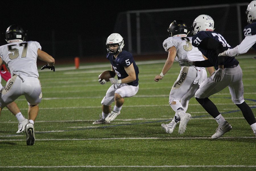 After a punt, senior wide receiver Logan Talley cuts through members of the opposing team.
