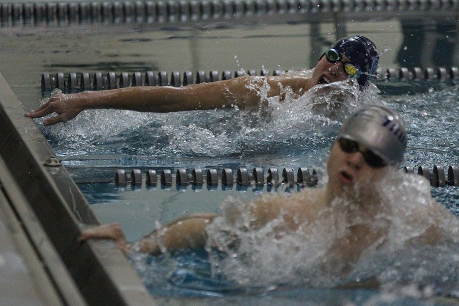 Coming in close towards his opponent, freshman Grant Nelson turns around to keep pace.