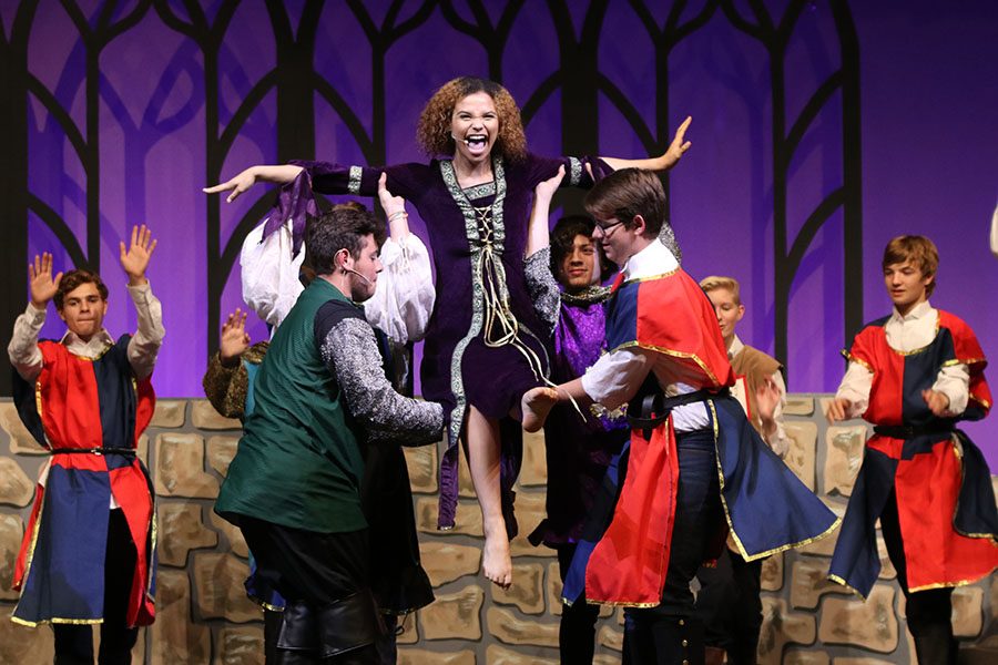 As Winifred, played by senior Lucy Graff,  is introduced, she is lifted up in the air as she sings during dress rehearsal for Once Upon A Mattress on Tuesday, Nov. 2. 