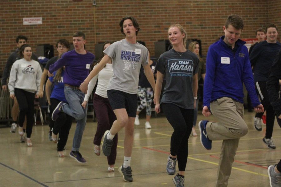 On Wednesday, Nov. 28, senior Ally Klaudt dances alongside the other participants at Cotillion practice held at Bishop Miege. “The dances were fun, which helped me be engaged while learning,” Klaudt said. “The steps weren’t too difficult and I found myself wanting to practice them.”