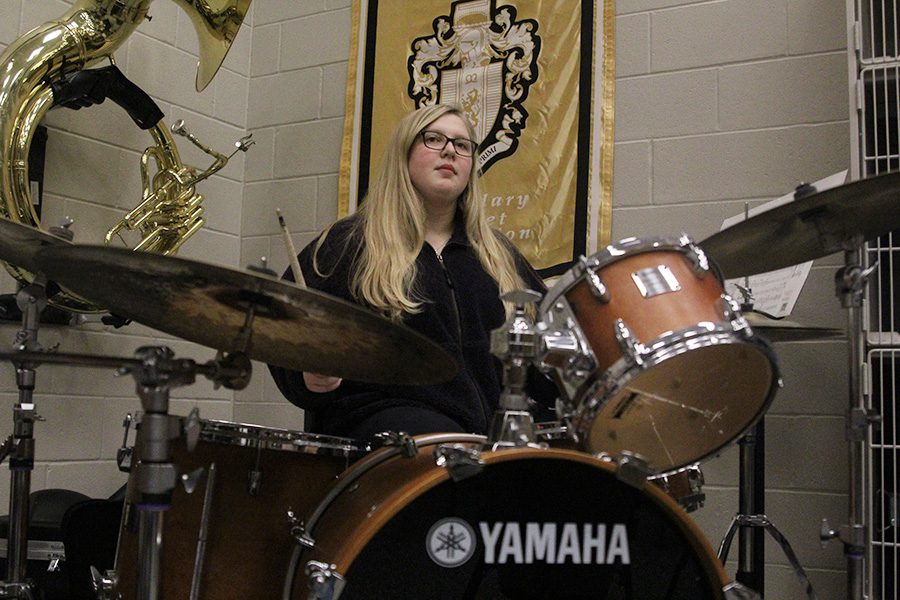 Behind the drum set, junior Abby Lee keeps a maintains a steady beat while keeping her eyes on band teacher Deb Steiner at the front of the class. “I love Band so Jazz Band seemed like something fun to try to just get as much band experience as possible,” Lee said, “It is just so different from concert and marching band, it has less structure and is more about feeling the music.