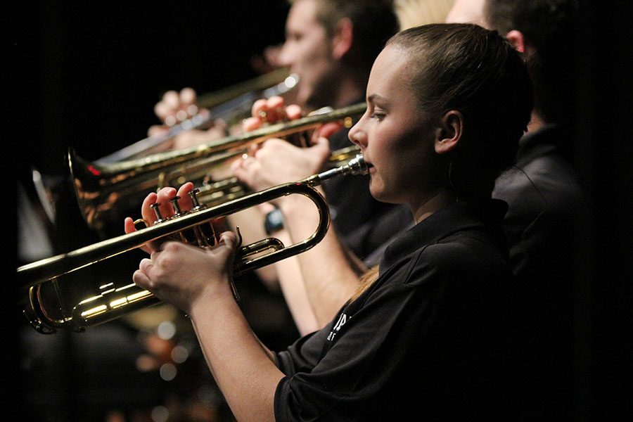 In the back line of trumpeters, freshman Katelyn Kurovski keeps her eyes on the sheet music and her trumpet held up straight.