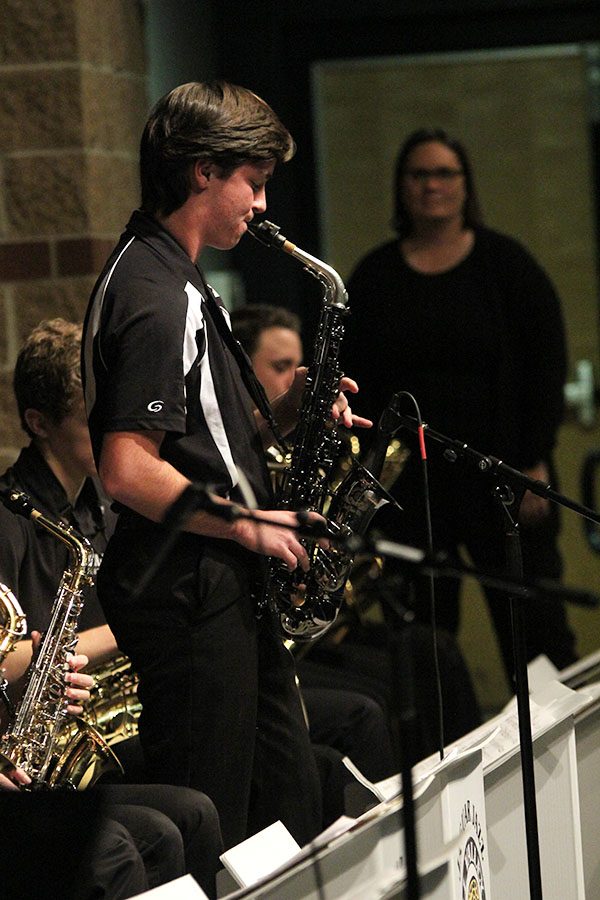 Junior Joey Gillette stands up for his solo performance during the Jazz Band concert on Thursday, Nov. 29.