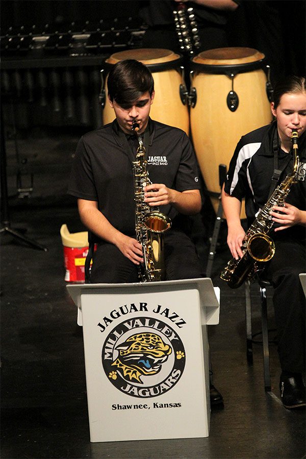 Junior Reese Hernandez performs on the alto sax during the Jazz Band concert in the Little Theatre.