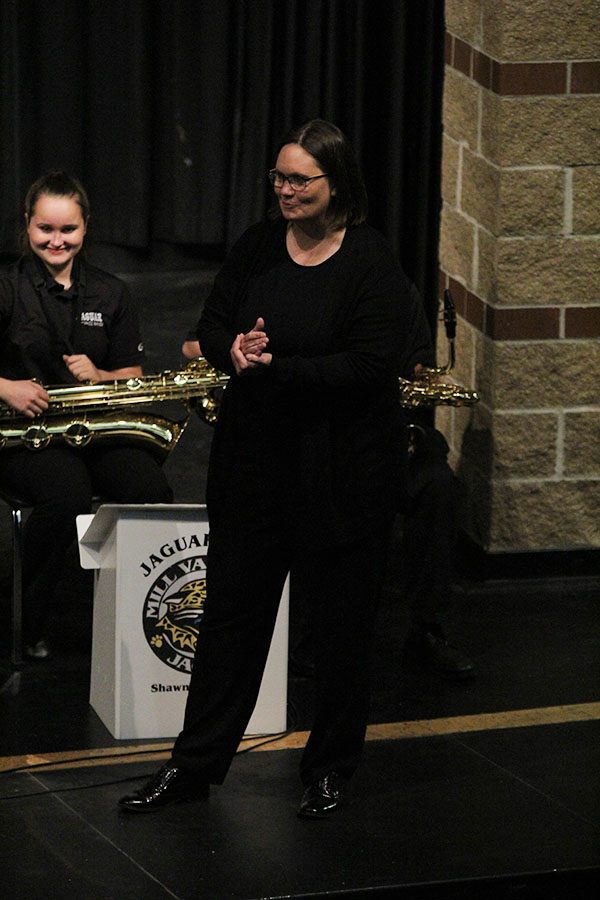 In between songs, Band teacher Debra Steiner introduces the next song.