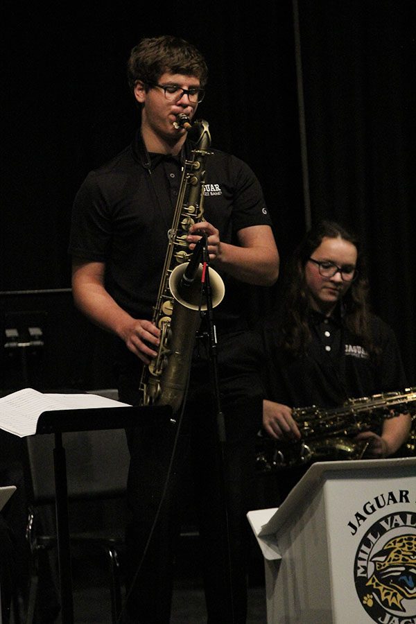 Standing up for his solo, junior saxophonist Michael Crockers executes the solo he prepared for in previous Jazz Band classes.