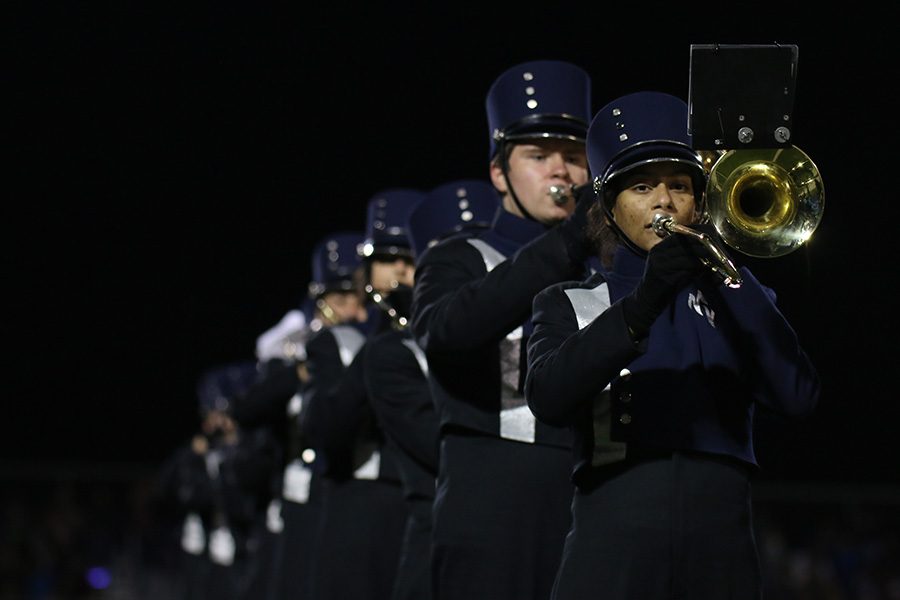 During the halftime show, senior Mercy Pryhozen focuses on the music.