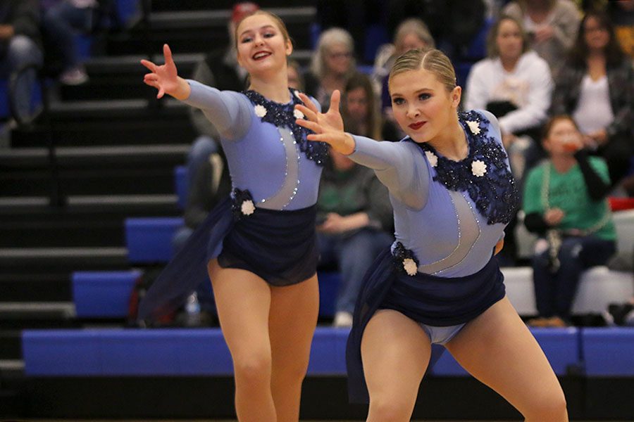 Reaching out, sophomore Jenna Haase performs in the lyrical jazz routine at the Kansas City Classic on Saturday, Dec. 8. At the Kansas City Classic, the team finished first in Division 3 pom and lyrical jazz, senior Olivia Augustine placed first in senior solos, senior Addie Ward placed seventh in senior solos and junior Sydney Ebner placed tenth in junior solos.