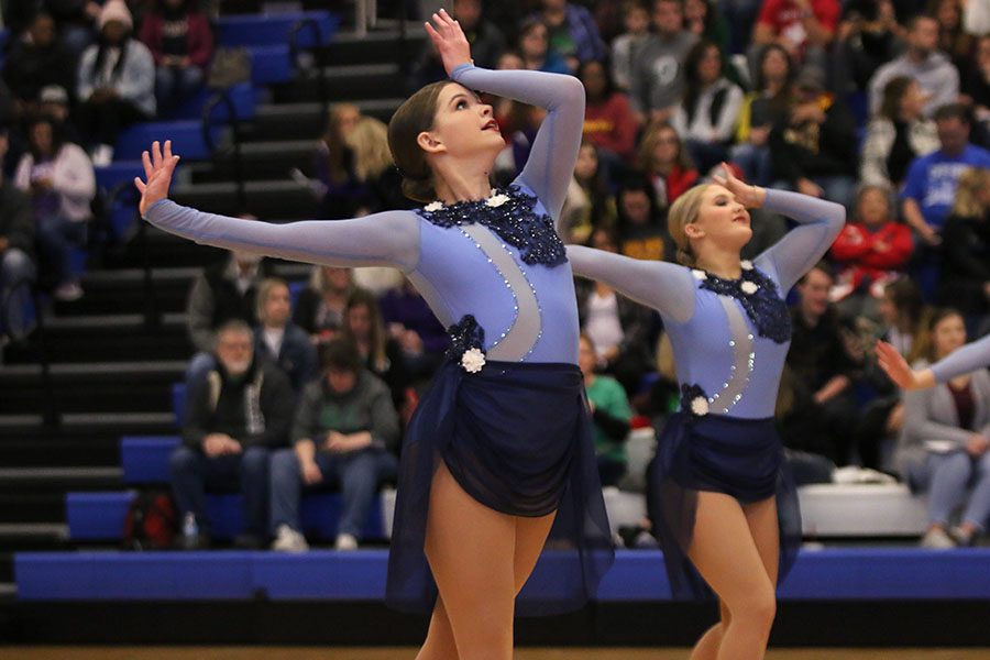 Pressing the ball of her hand to her forehead, sophomore Tyler Bret performs the lyrical jazz routine at the Kansas City Classic on Saturday, Dec. 8.
