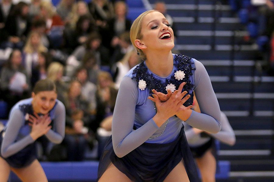 As she performs the lyrical jazz routine at the Kansas City Classic on Saturday, Dec. 8, senior Bella Line holds her hands to her chest.