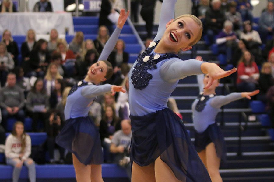 Reaching out, senior Bella Line performs in the lyrical jazz routine. This routine placed first at the Kansas City Classic on Saturday, Dec. 8.