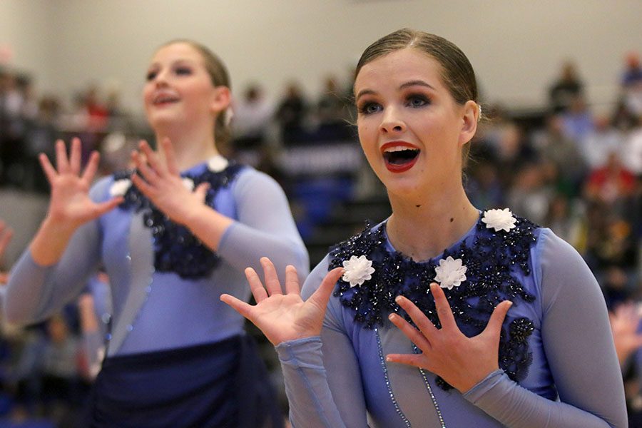 Reaching her hand out, sophomore Tyler Bret performs the lyrical jazz routine at the Kansas City Classic on Saturday, Dec. 8.