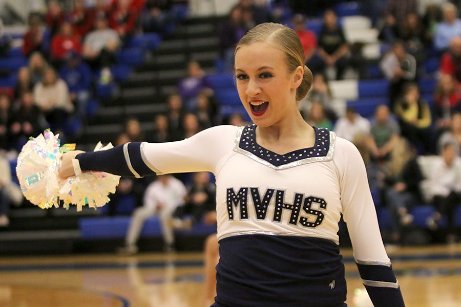 Pom out, freshman Hadley Skinner performs in the pom routine at the Kansas City Classic on Saturday, Dec. 8.