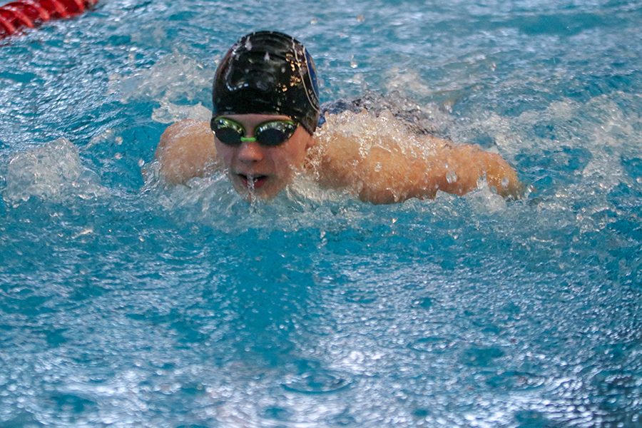 Nearing the wall, freshman Ryan Biven prepares for his turn.