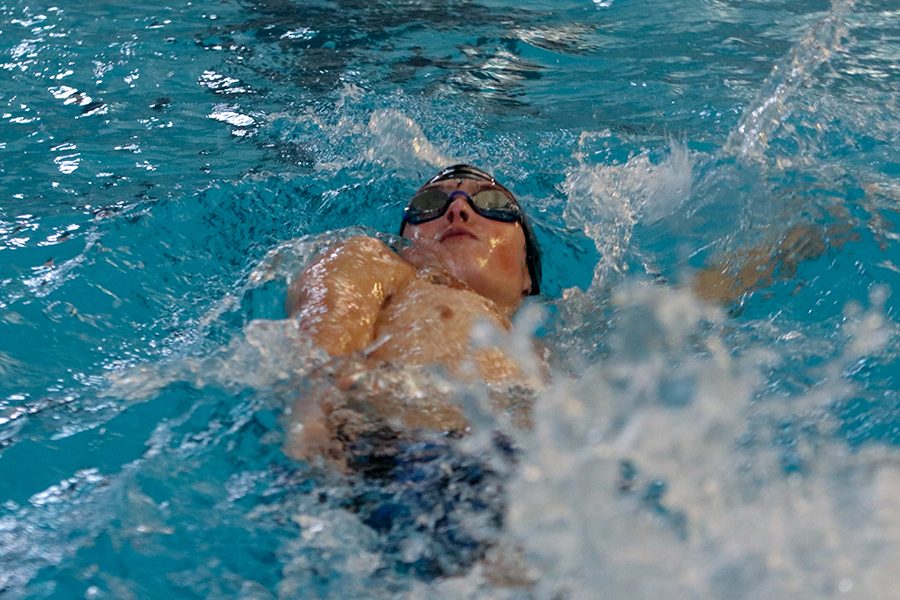 After making a turn, freshman Grant Nelson goes down the pool for the last time. 