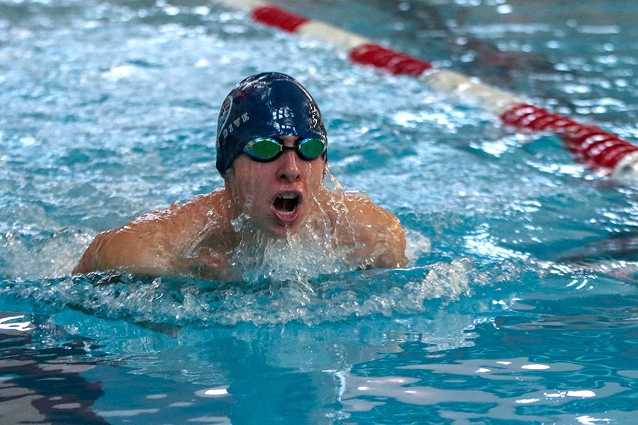 Looking down the lane, junior Avery Lawson competes in the 200-yard breaststroke.
