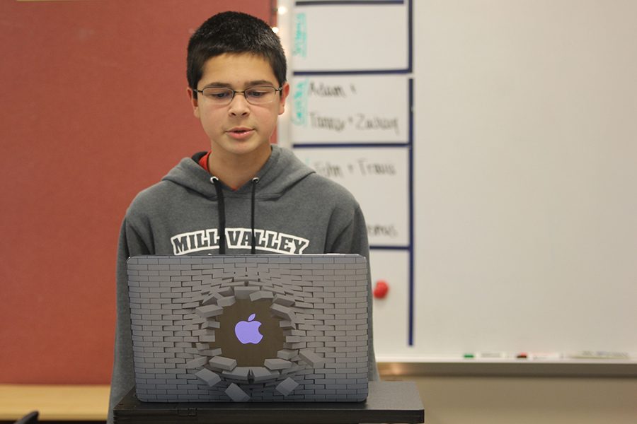 At the start of the debate work night on Thursday, Nov. 29, sophomore Adam White practices spreading- or speed reading. The team competed at Shawnee Mission South. "With all of the competition, we were really proud of the way we performed [on Saturday, Dec. 1]."
