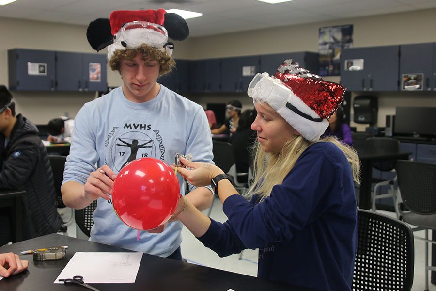 In the Experimental Design event, juniors Logan Oesterreich and Callie Roberts design their own experiment using a balloon, tape measure, scissors, paper, a straw and tape.