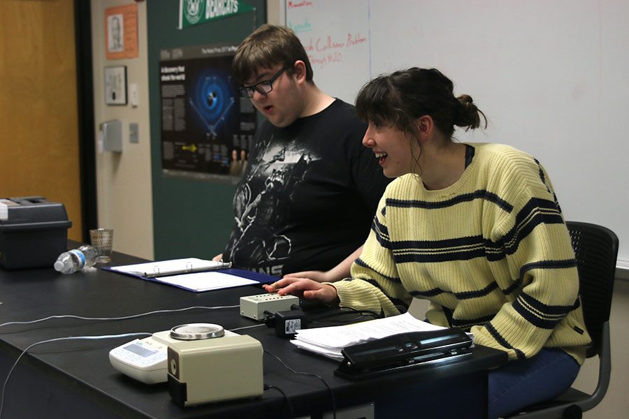 Conducting a buzzer test, junior Analiese Wilhauk calls out a competitors line on Wednesday, Dec. 5.