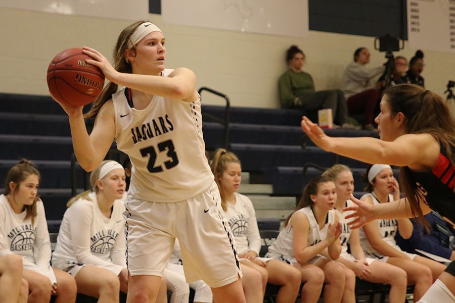 On offense, senior Claire Kaifes looks to pass the ball to another teammate.
