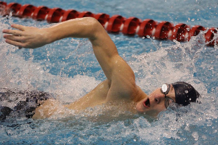 Sophomore Cole McClure competes in the 200 yard freestyle relay.