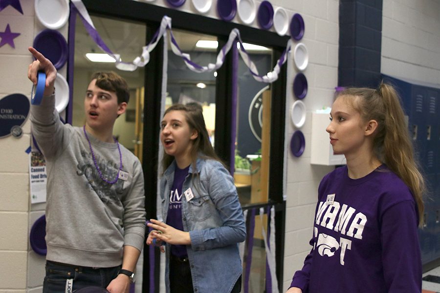 Working+together%2C+seniors+Johannes+Seberger%2C+Jessie+Coleman+and+Kate+Backes+were+crucial+members+in+the+preparation+for+the+purple+bomb+and+Relay+for+Life+rally+held+on+Friday%2C+Jan.+11.++We+wanted+people+to+come+%5Bto+the+rally%5D+and+get+more+excited+and+have+an+idea+of+what+happens+at+relay%2C+said+Backes.