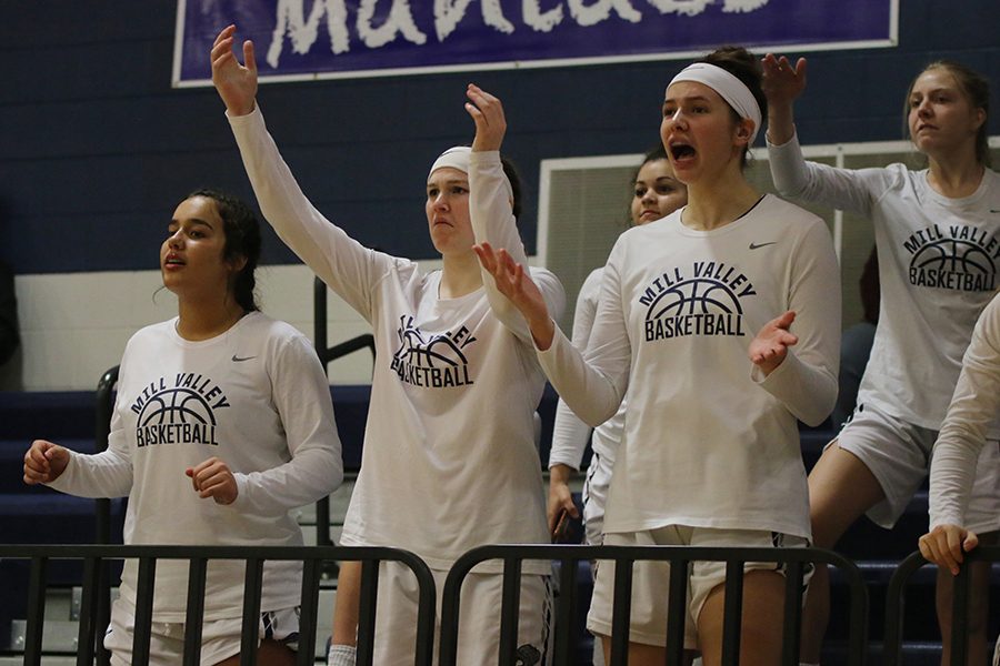 Raising their arms up in frustration, seniors Claire Kaifes and Trinity Knapp react to the call the referees make against JV girls.