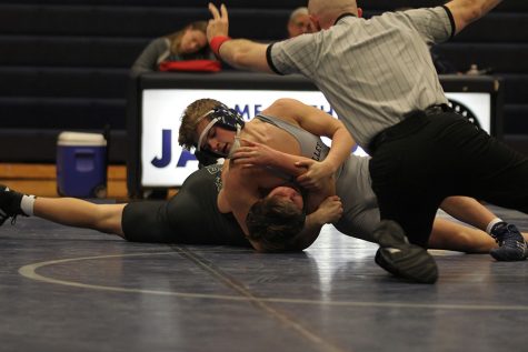 Jaguars wrestle De Soto in senior night dual