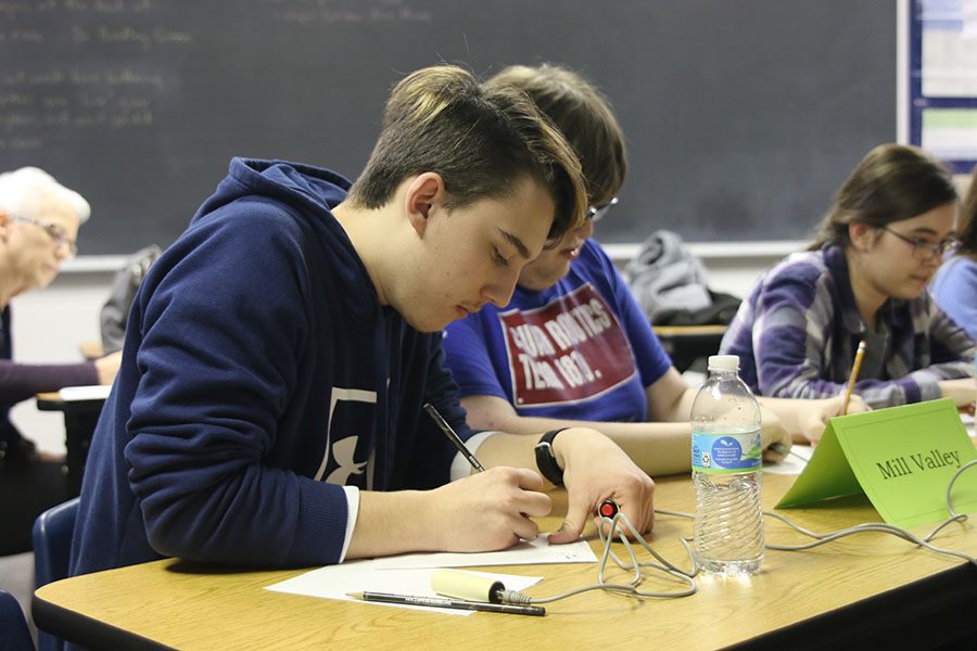 During round three against Tonganoxie, senior Johannes Seberger quickly solves a math problem at the Maranatha Academy tournament on Thursday, Jan. 17. After competing in a total of seven rounds, the team placed third overall, nearly making it into the final round. Overall, we performed really well [because] we had a strong performance with some members more experienced than others, Seberger said.