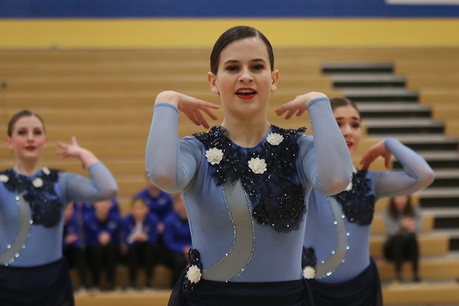 Folding her arms, senior Olivia Augustine participates in the jazz routine.
