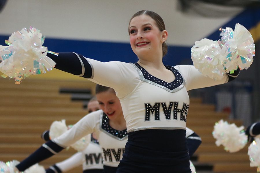 During the pom routine, sophomore Kenzie Harris looks to fellow dancers. 