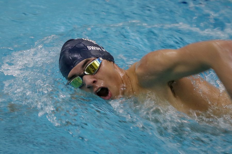 Coming up for air, sophomore  Cole McClure l competes in the 200-yard freestyle. Boys swim finished second at the Olathe South Swim Meet on Wednesday, Jan. 16.