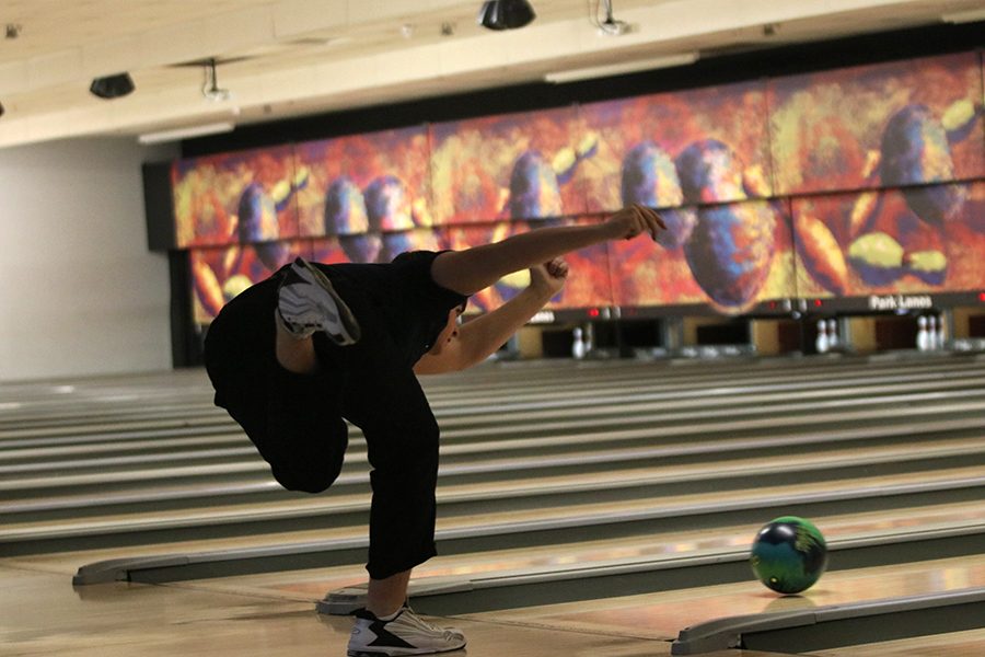 After throwing the bowling ball, sophomore Devin Kuhlman knocks down all ten pins and gets a strike. He ended with a final score of 507 at the bowling meet on Thursday, January 17.
