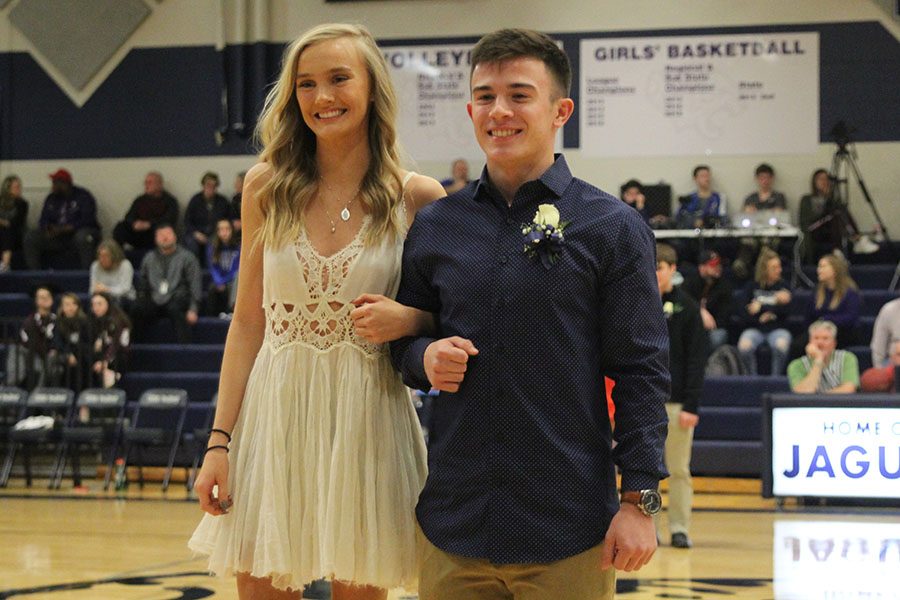 Pairing up on the court, senior WOCO candidates Olivia Loftin and Henry Lopez pose for audience members.