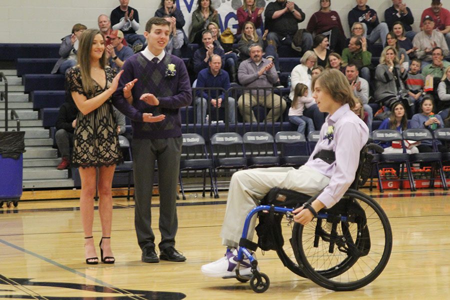 Following senior Nolan Spragues announcement as WOCO king, fellow candidates seniors Lydia McDaneld and Joe McClain applaud.