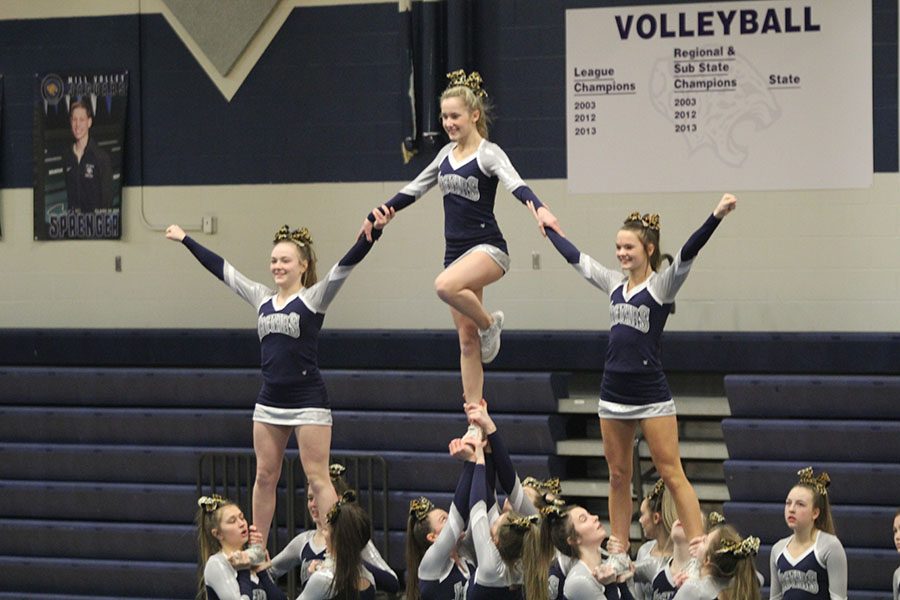 As+their+last+move+for+the+De+Soto+Cheer+Showcase+on+Monday%2C+Feb.+25%2C+the+cheer+team+performs+a+stunt.