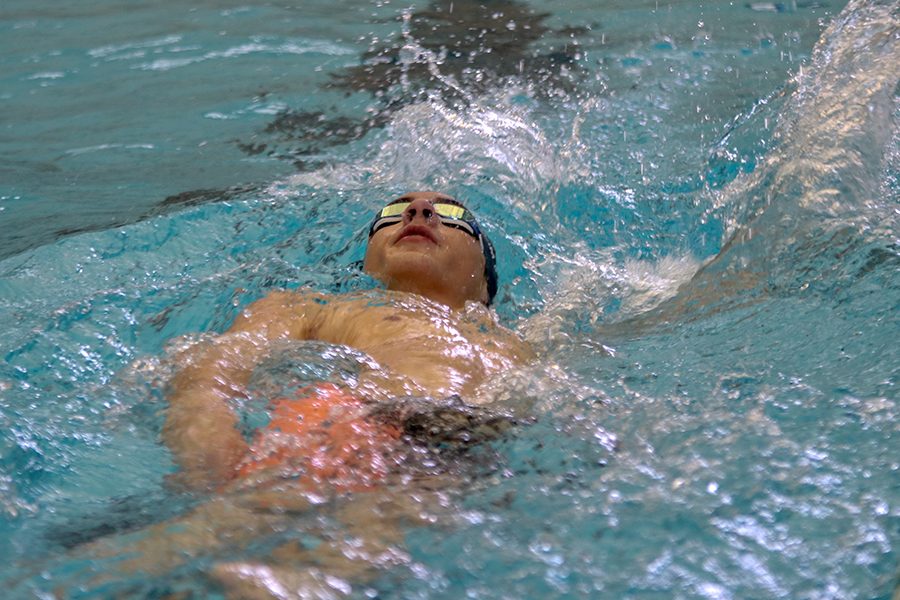 After making a turn, sophomore Cole McClure makes his way back down the pool doing the freestyle. 